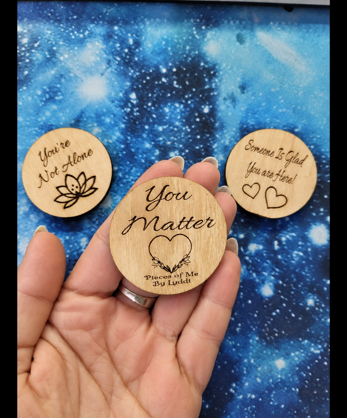 The first three kindness tokens Lyddi created in March 2026: You’re Not Alone, You Matter, and Someone Is Glad You Are Here