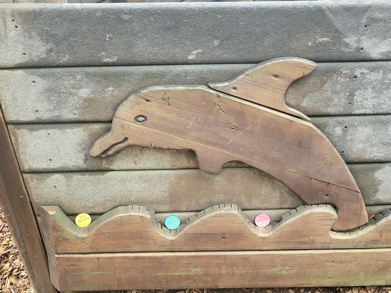 Heartwork tokens placed in an outdoor public garden display