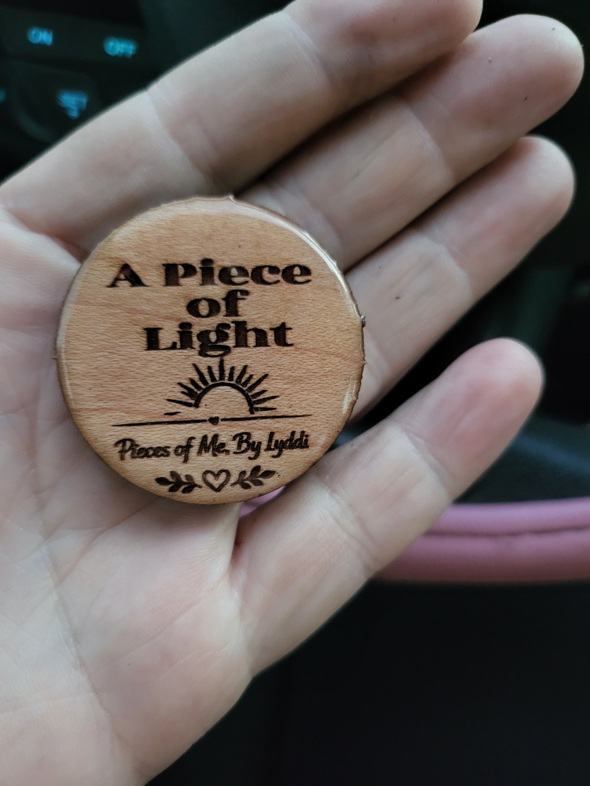 Heartwork tokens arranged in a small outdoor garden display