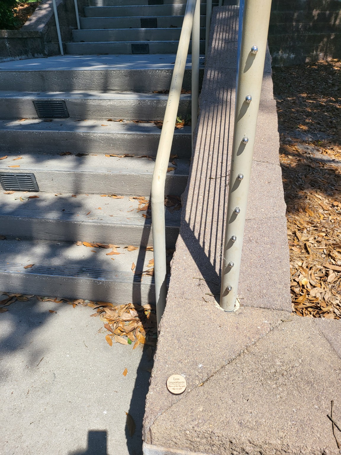 A heartwork token placed beside a public stairway and walkway