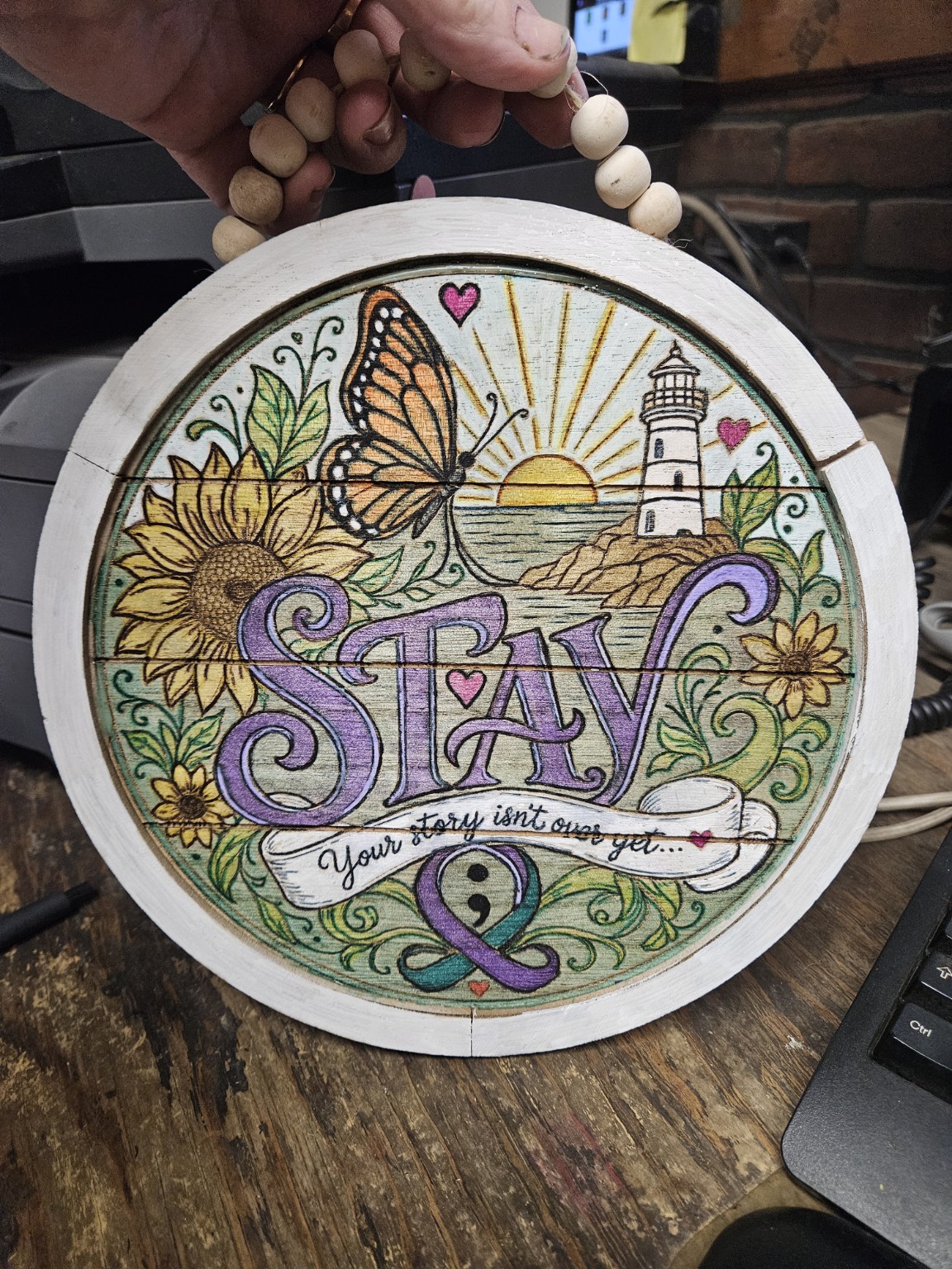 Fully colored seven-inch round STAY wooden artwork